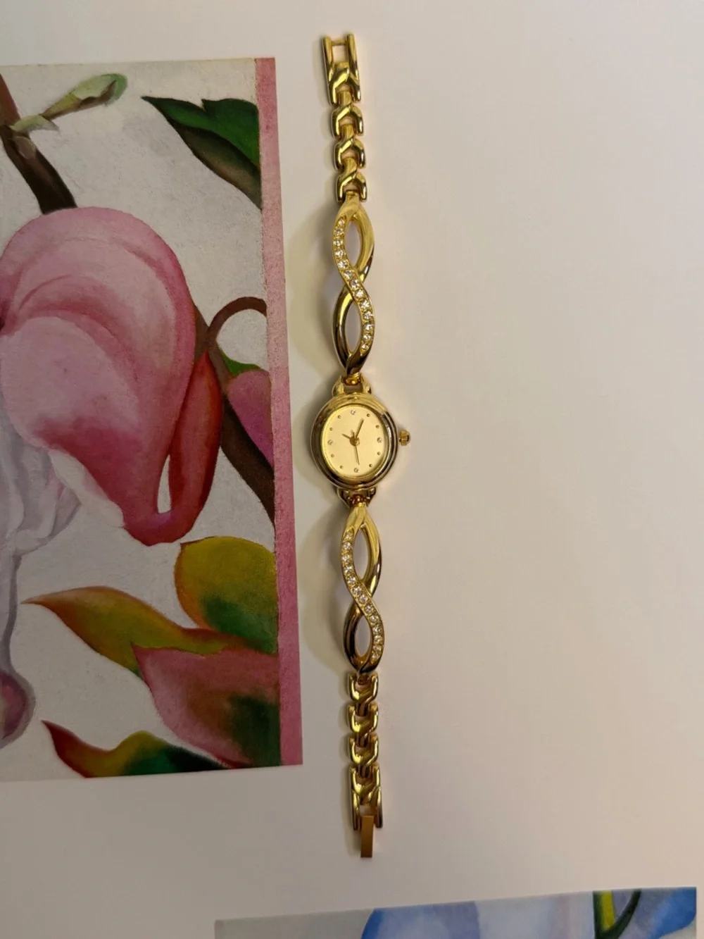 Elegant Gold-Tone Women's Bracelet Watch with Crystals on a Dial